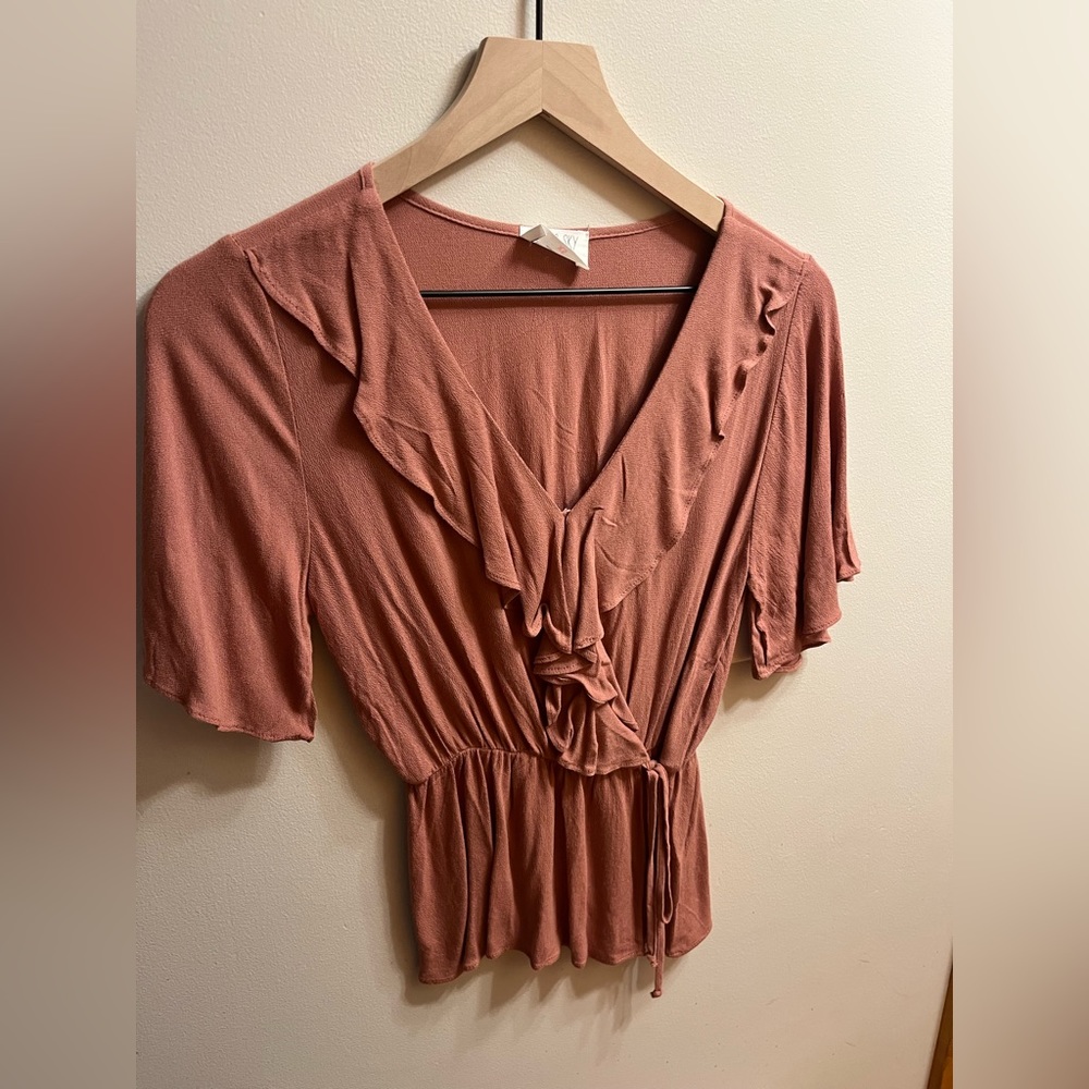 Peach colored short sleeve ruffle shirt